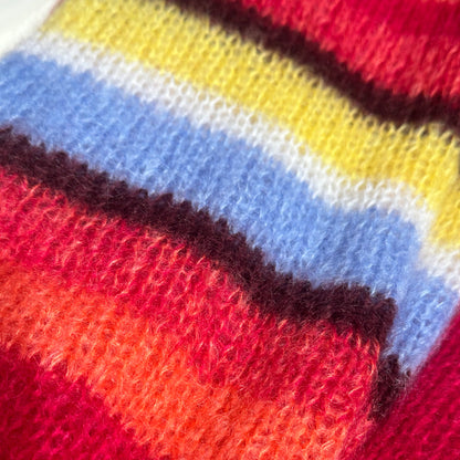 Striped sleeve detail on a hand-knitted jacket